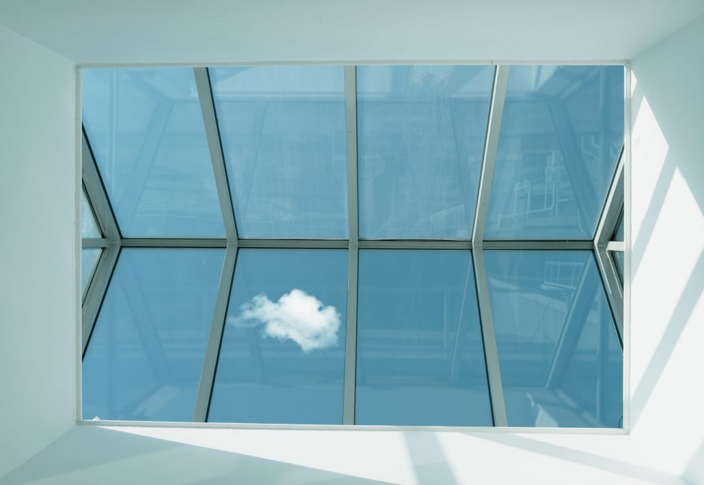 Low angle photography of clear glass roof
